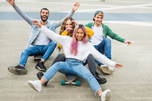 istock Group of young students bonding outdoors 1286846977
