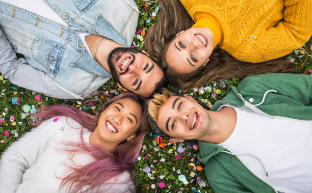 istock Group of young students bonding outdoors 1286847688