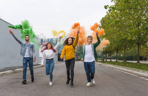 istock Group of young students bonding outdoors 1286847713