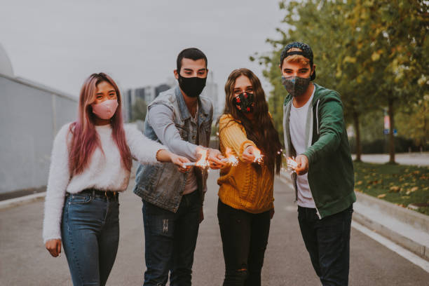 istock Group of young students bonding outdoors 1286847965