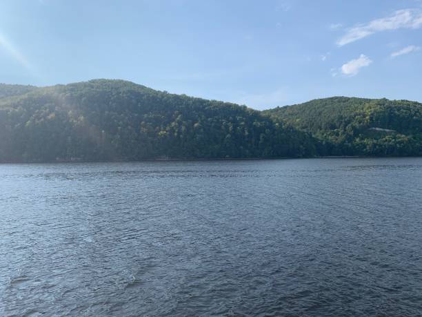 istock Green hills on the river 1286849436