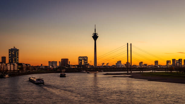 Sunset in Dusseldorf - Germany Sunset in Düsseldorf - You See the Rheinkniebrücke and Rheinturm düsseldorf photos stock pictures, royalty-free photos & images