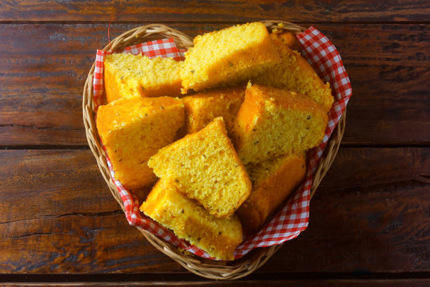 istock corn cake sliced in basket on rustic wooden table for breakfast. Typical Brazilian food. 1286852226