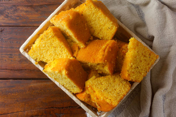 istock corn cake sliced in basket on rustic wooden table for breakfast. Typical Brazilian food. 1286852258