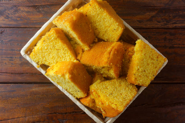 istock corn cake sliced in basket on rustic wooden table for breakfast. Typical Brazilian food. 1286852293