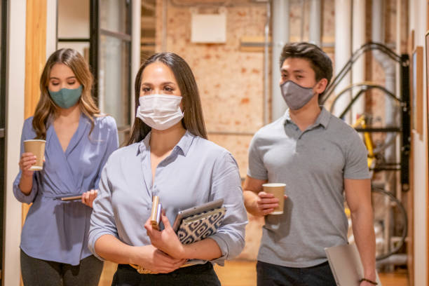 istock Office workers go back to work during COVID-19 pandemic 1286854132
