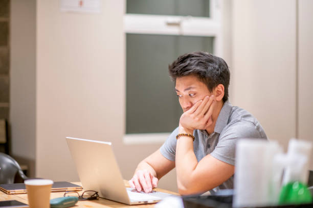 istock Young business people working late 1286854148