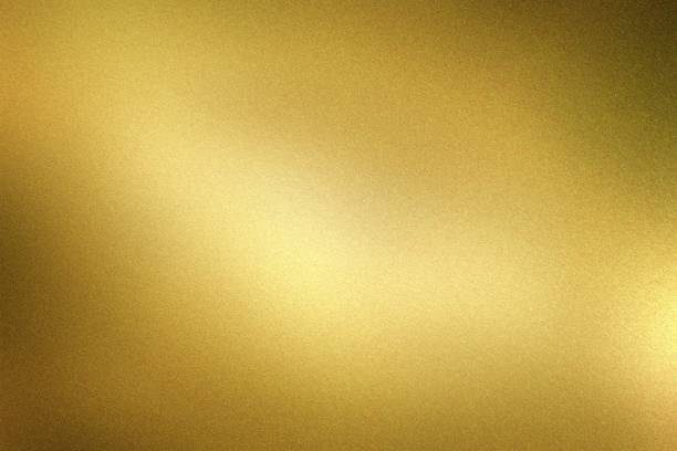 istock Glowing dark gold foil metal wall with copy space, abstract texture background 1286854868