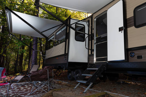 istock Door open on a  camper trailer at a campsite 1286854871