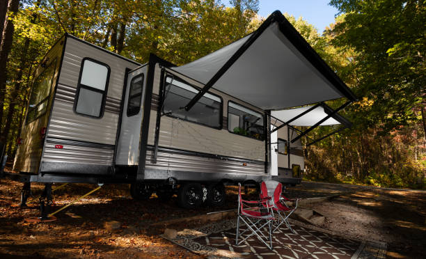 istock Daytime in camp with a travel trailer 1286855090