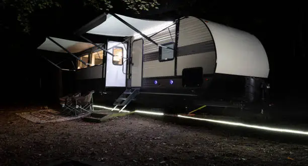 Photo of Lighted pathway in front of a camper trailer