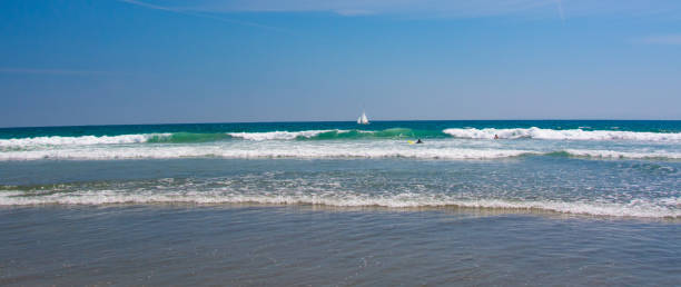 istock Beach Scene-with sail boat-Newport Beach,  California 1286859231