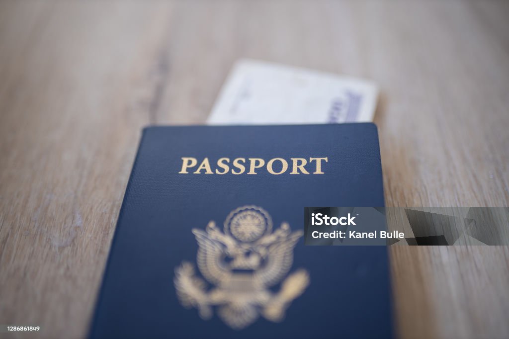 United States of America Passport with a Two Honduran Lempiras Bill Under it Picture of a United States of America Passport with a Blurry Two Honduran Lempiras Bill under it UK Stock Photo