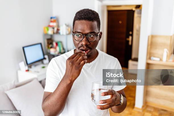 Managing Pain So He Can Get Back To Being Productive Stock Photo - Download Image Now
