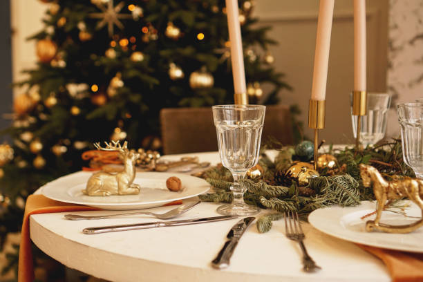 istock Table served for Christmas dinner in living room, close up view 1286863136