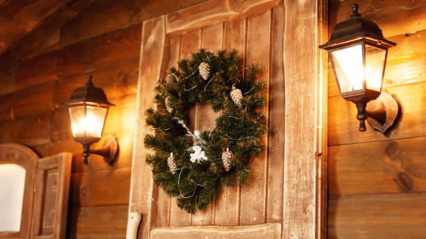 Christmas wreath on the door of an historic log cabin
