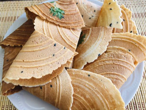 istock Traditional Thai desserts name Thong Pab in a white plate placed on a mat 1286864843