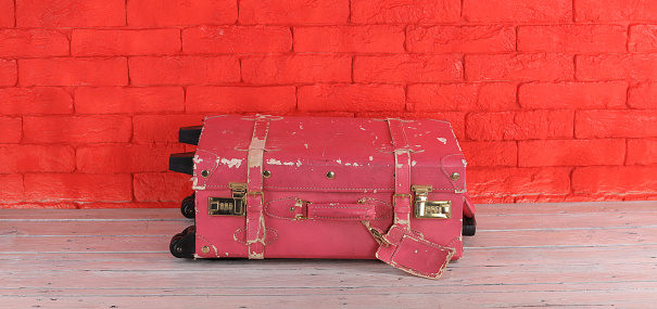 old vintage pink travel suitcase