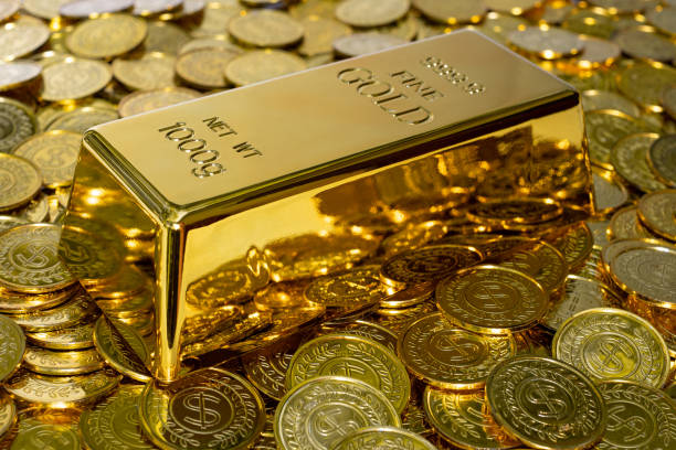 istock Closeup shiny gold bar 1 kg on the stack gold coin 1286867079