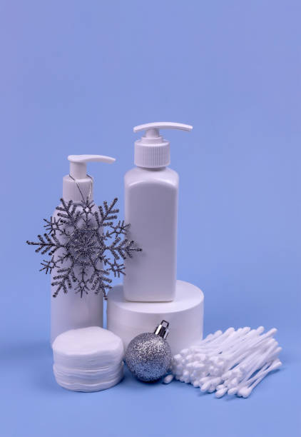 istock containers with cosmetics on a blue background.Winter care 1286867173
