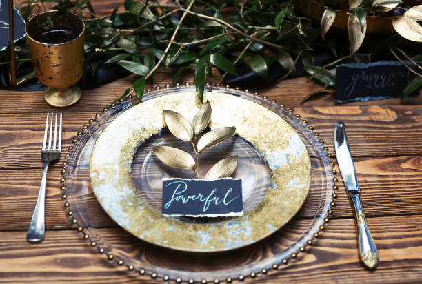 istock Festively set table with a card with the word POWERFUL 1286868576