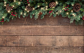 istock Christmas Garland on an Old Wood Background 1286871100