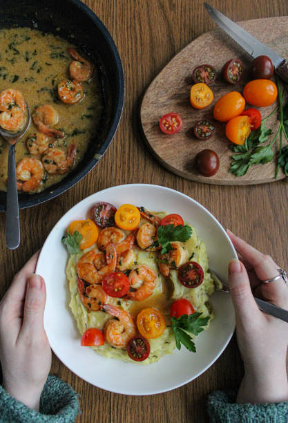 istock Beautiful mashed potatoes, shrimp and cherry tomatoes spring dish full of colours and textures. 1286871272