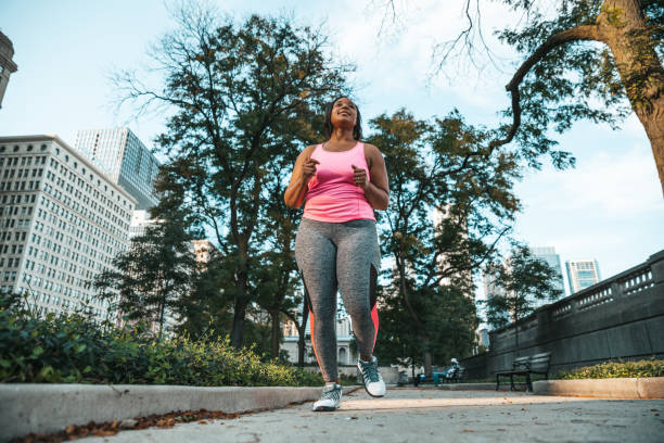 istock Woman getting healthy and fit training outdoors 1286873056