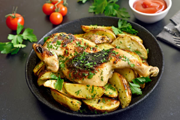 istock Spatchcocked grilled chicken and fried potato wedges 1286874855