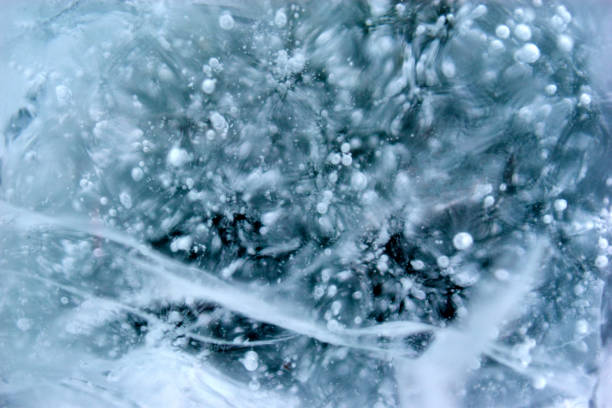 Blue blocks of ice close up with bubbles and cracks