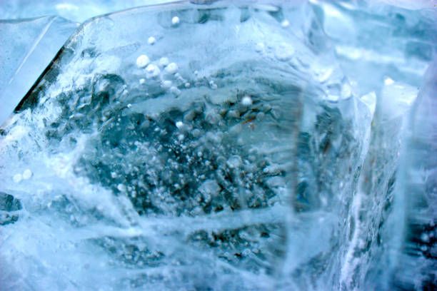 istock Blue blocks of ice close up with bubbles and cracks 1286875433