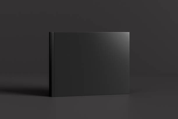 istock Hardcover horizontal or landscape black mockup book standing on the black background. 1286876824