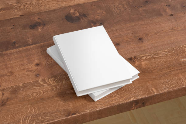 istock Vertical white hardcover book stack mockup on the wooden table. 1286878246