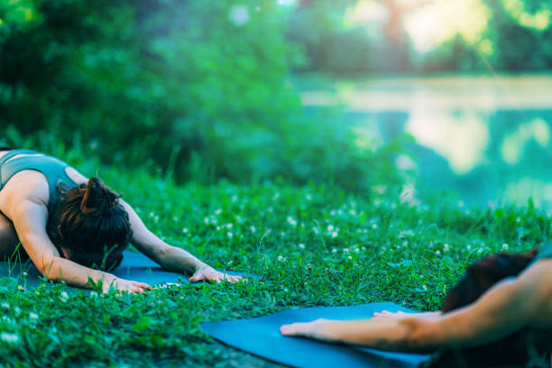 istock Meditation by the Water. Child Position. 1286878589
