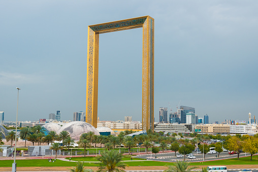 Dubai, UAE - March, 15, 2019 - the Dubai Frame - building to visit dubai from height is a platform for tourists to have a nice view to the skyscrapers. Dubai Frame is a building that opened in 2018. Through this frame one sees either the modern Dubai around the Burj Khalifa or from the other direction the old Dubai with the district Deira.