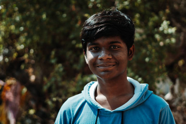 istock Portrait of an Indian kid smiling while looking towards the camera 1286881218