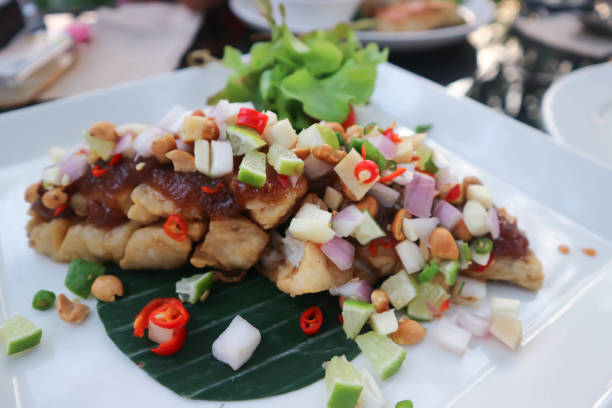 istock grilled bass , grilled fish with spicy dressing 1286881356