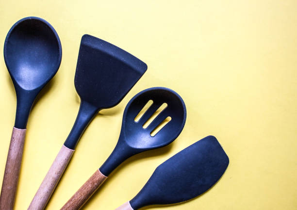 istock flat lay on yellow background kitchen cooking tools and accessories. Concept of home design. Free copy space. 1286882824