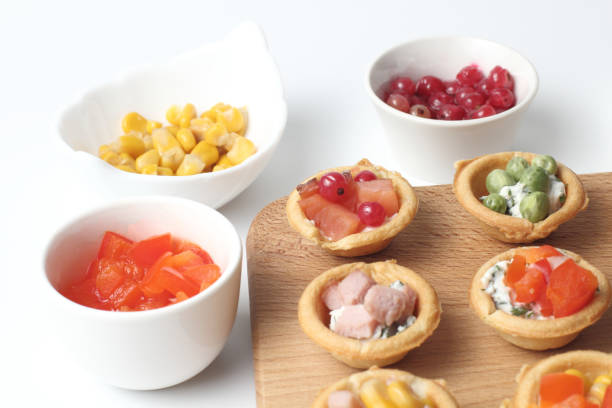 istock Tartlets with snacks for beer or cider, tapas, appetizer, close-up, white background. 1286882856