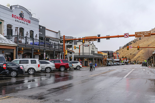 Jackson Hole, Wyoming, United States - November 08, 2020: Downtown street view of Jackson Hole in Wyoming USA. The town is covered with first snow of the season. Popular town in summer and winter for proximity to Yellowstone and Grand Teton National Park.