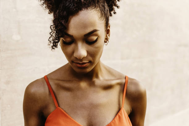 istock African American descent woman looking down portrait 1286885127