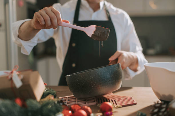asian chinese dessert chef cook preparing and stirring chocolate ingredient preparation for shortbread christmas celebration