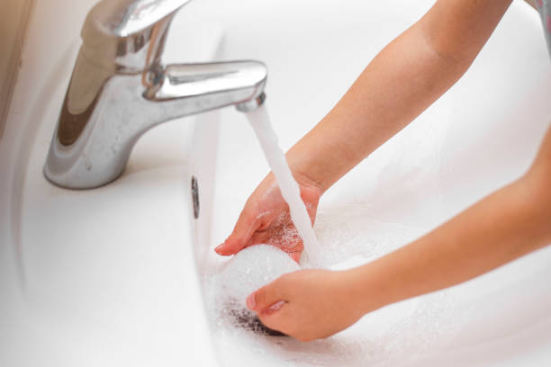 istock the child washes his hands with foam 1286888587