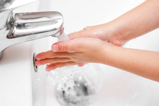 istock the child washes his hands with foam 1286888592