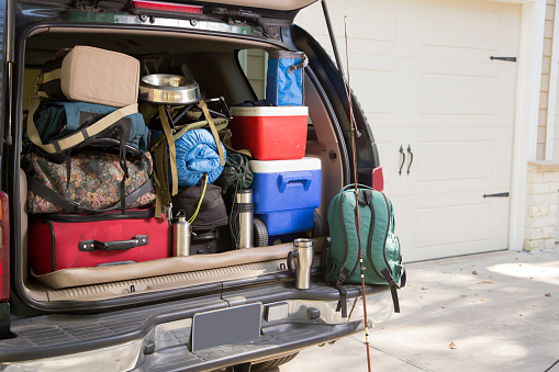 Vehicle fully packed for a hiking and camping trip. Dog bowl included. Fishing rod included.
