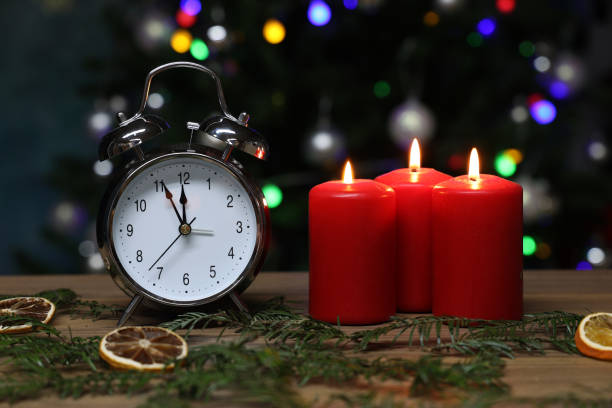 istock New year composition with alarm clock and burning candles 1286889921