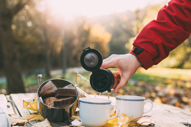 istock Cookies and tea on wooden table outdoor 1286890153