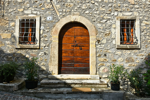 Castrovalva, Italy, 08/05/2018. The door of an old house in  a small mountain village of medieval origin in the Abruzzo national park.