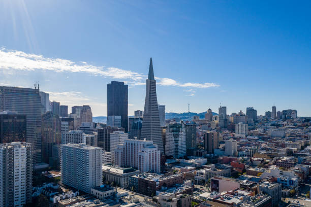 Aerial View of San Francisco Skyline Aerial view of San Francisco skyline on a blue sky day. Iconic buildings and skyscrapers fill the horizon. transamerica pyramid san francisco stock pictures, royalty-free photos & images
