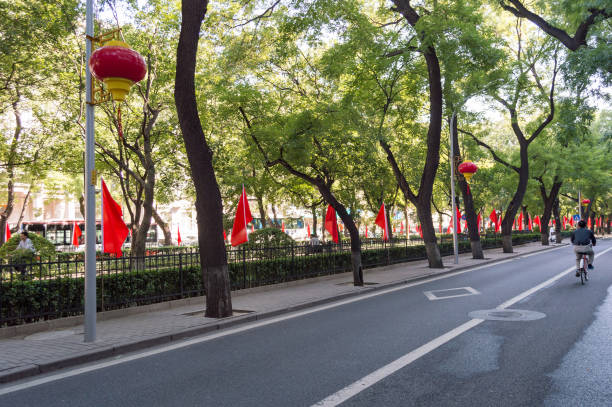 National flags of the People's Republic of China in the streets of Beijing Beijing / China - September 28, 2018: National flags of the People's Republic of China in the streets of Beijing, commemorating the national holiday, 1st of October, Founding Day of the PR of China. xi jinping stock pictures, royalty-free photos & images